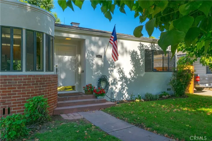Art Deco windows make this unique home stand out, even by Lakewood Village standards!