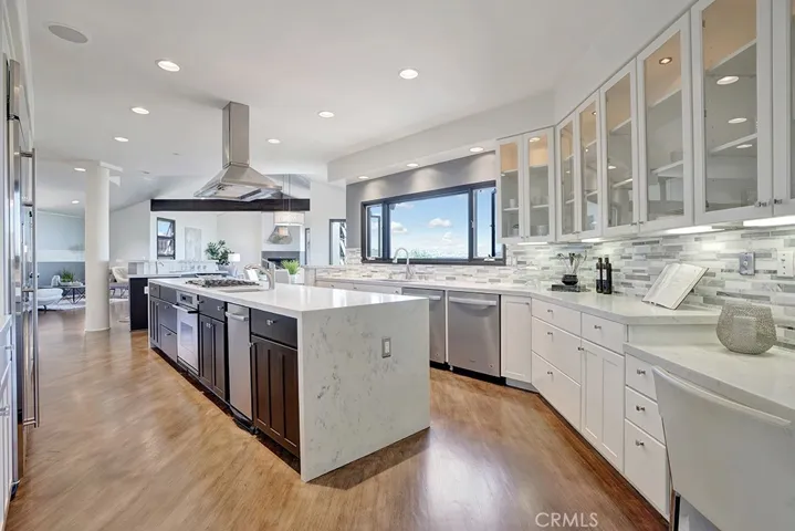 Incredible Remodeled Kitchen with stunning Waterfall White Quartz countertops!