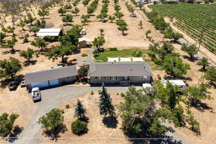 Almost 10 acres of privacy to enjoy! Fenced animal area along with existing walnut orchard. Surrounded by vineyards with no neighbors in site!