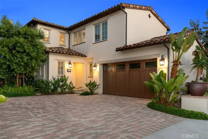 Contemporary Mediterranean exterior styling introduces this luxury detached home.