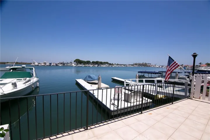 Large Boat dock included 30 ft slip.  View from your Extra Large Patio/Deck with Spectacular Views of the Harbor and Wetlands