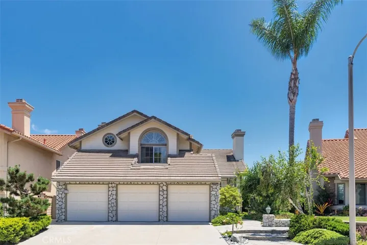 Exquisite Laguna Crest Estates home with panoramic views of the mountains, city lights and picturesque hillsides!