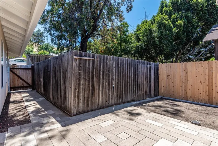 Back patio with gate access to front yard