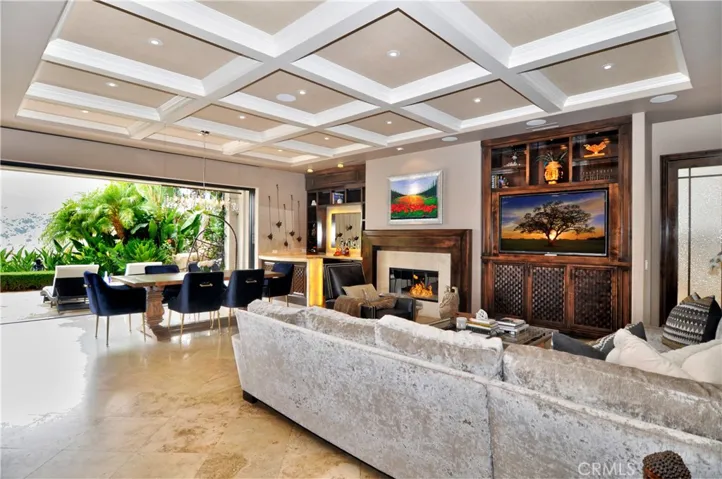 This is what greets you the minute you walk into the property... FOREVER VIEWS! Highly upgraded great room include coffeed ceilings, built ins, custom bar and fireplace surround, electric in ceiling blinds, and those amazing pocket doors that frame your dramatic canyon view!