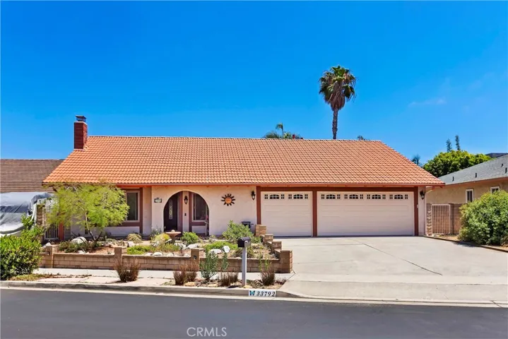 Note the uncommon 3 car garage plus lots of driveway parking