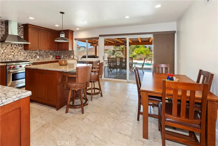 Open plan kitchen extends visually to the outside dining area and spa