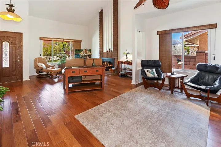 A view from the dining area to the living room.  High ceilings expand the space