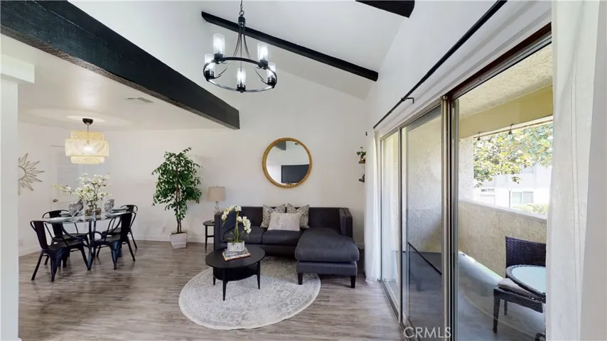 Living Room w/vaulted ceiling & Dining Room