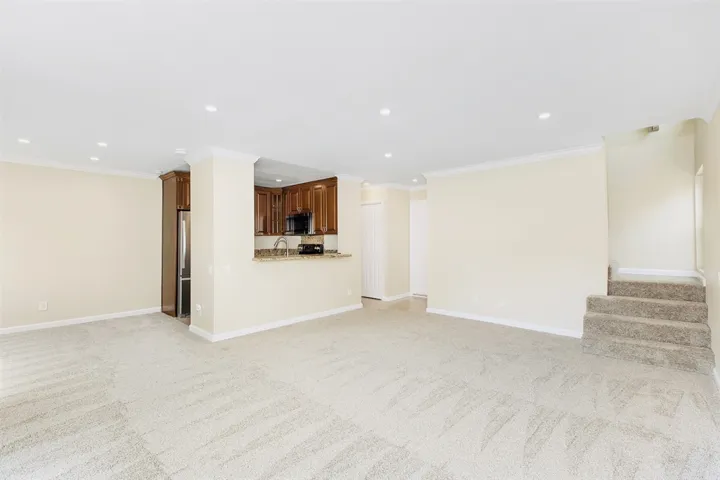 Spacious Living Room with scraped ceiling and recessed lights on dimmers!