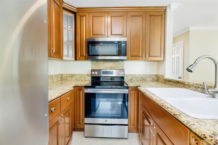 All new appliances! Whirlpool refrigerator, GE Oven/Range, built-in microwave and dishwasher.