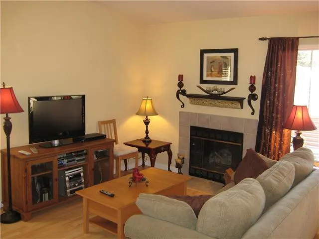 Lavish furniture , flat screen TV and cozy fireplace
