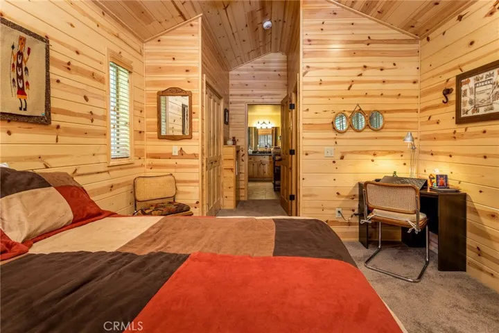Master bedroom with closet and door to the bathroom.