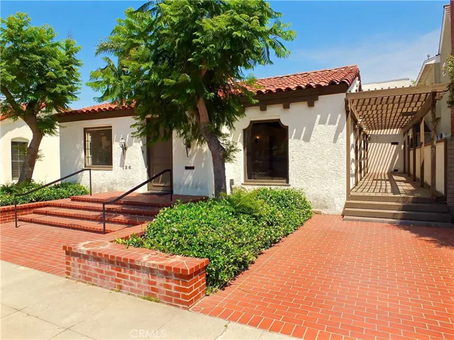 Opportunity knocks at the door of this Charming 1926 Spanish fixer on a lot and a half in the heart of Naples!