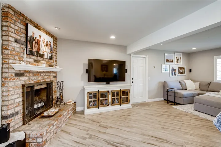 Open & spacious living room with views of both the tropical backyard to the North and the Carlsbad Hills surrounding the lagoon to the South. Fireplace is both gas and wood burning. Really nice room to cozy up!