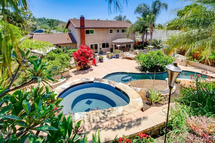 Views of the this stunning property & the Carlsbad Lagoon from the top of the backyard terraced sand pathways.
