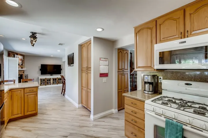 The pantry has pull out shelving.
