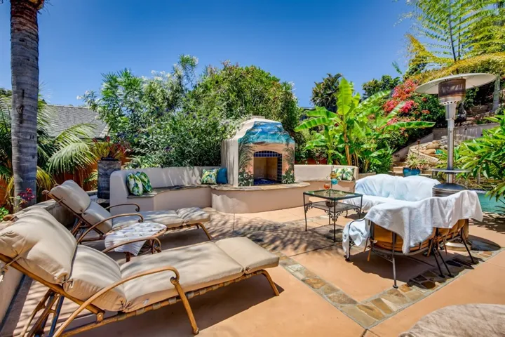 This outdoor fireplace adds another entertaining or relaxing option to this spectacular backyard.