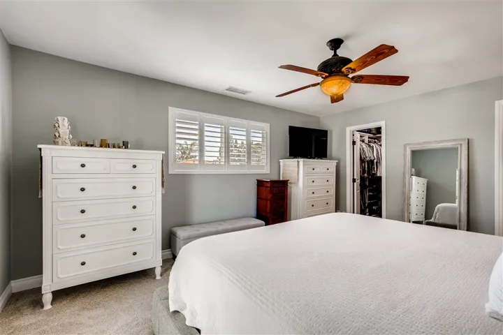 Spacious master bedroom. Nice ceiling fan.