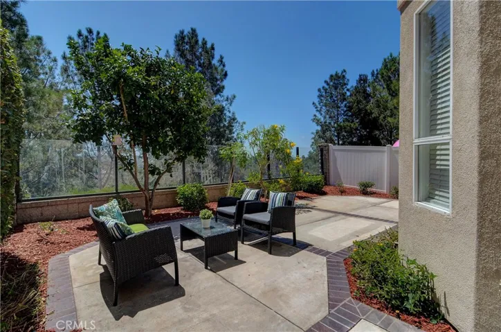 Private rear yard is a true paradise with plenty of entertaining space and panoramic view...plus low maintenance!