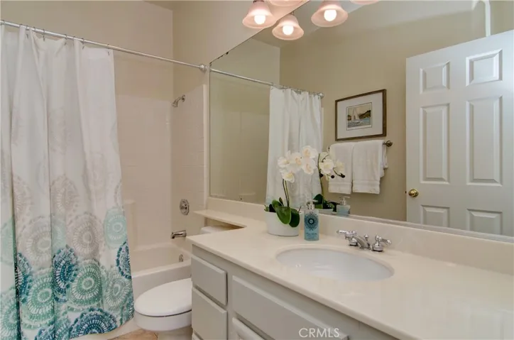 Sparkling hall bath is conviently located in guest bedroom wing.