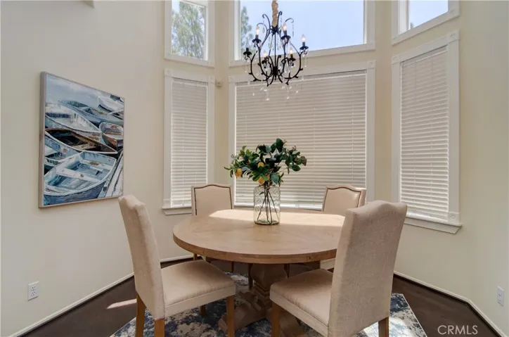 Round tables are the best!  This formal dining bay can accommdate one with enough room for everyone.