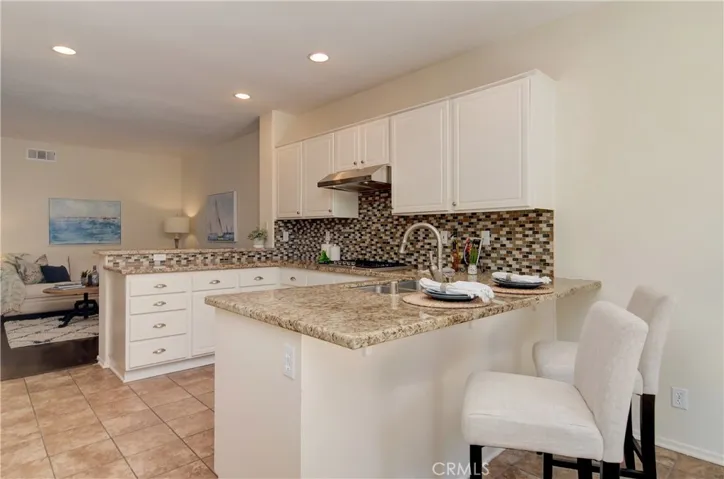 Beautifully remodeled kitchen has breakfast bar and opens to family area...the chef is always part of the action here!