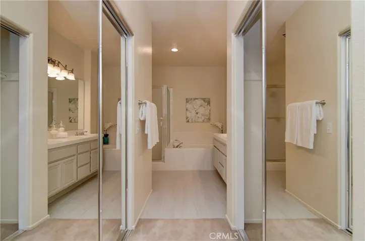 Double closet dressing area is convenient to both the master bedroom and bathroom.