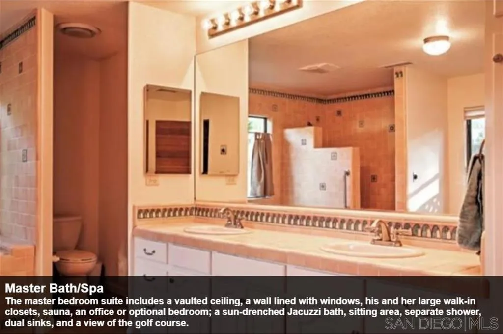 The master bedroom suite includes a vaulted ceiling, a wall lined with windows, his and her large walk-in closets, sauna, an office or optional bedroom; a sun-drenched Jacuzzi bath, sitting area, separate shower, dual sinks, and a view of the golf course.