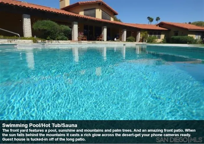 The front yard features a pool, sunshine and mountains and palm trees. And an amazing front patio. When the sun falls behind the mountains it casts a rich glow across the desert-get your phone cameras ready. Guest house is tucked-in off of the long patio.