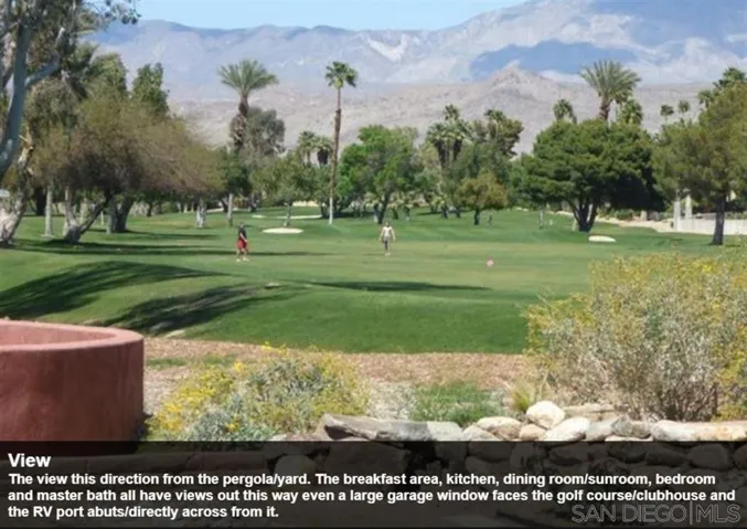 The view this direction from the pergola/yard. The breakfast area, kitchen, dining room/sunroom, bedroom and master bath all have views out this way even a large garage window faces the golf course/clubhouse and the RV port abuts/directly across from it.