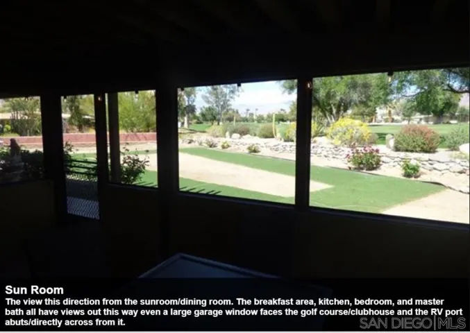 The view this direction from the sunroom/dining room. The breakfast area, kitchen, bedroom, and master bath all have views out this way even a large garage window faces the golf course/clubhouse and the RV port abuts/directly across from it.