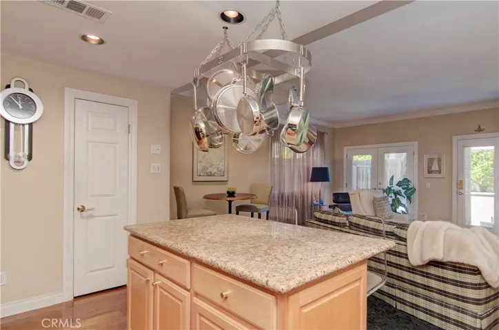 The chef is always part of the action here!  Bar is the perfect place for helpers to watch the action or kids to complete homework.  Convenient walk-in pantry adds loads of storage space.