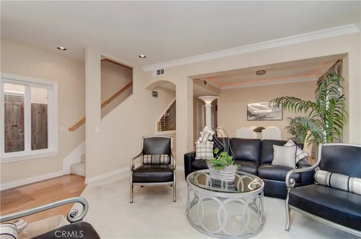 Elegant style includes nice architectural elements, crown moldings and lux carpets in the formal living room.