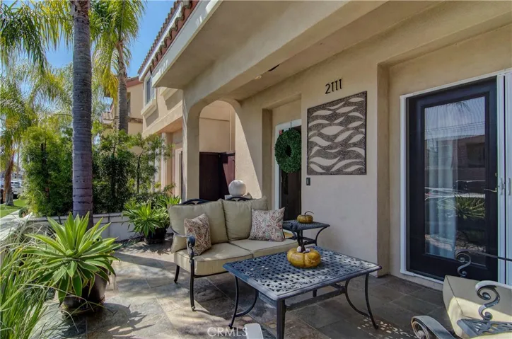Beautiful slate and custom iron details, plus lovely French doors create the ultimate place to enjoy cocktail hour.