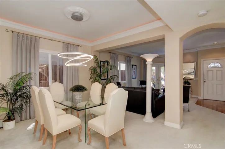 Designer details, including contemporary lighting elements make this large formal dining space a special place to entertain family and friends.