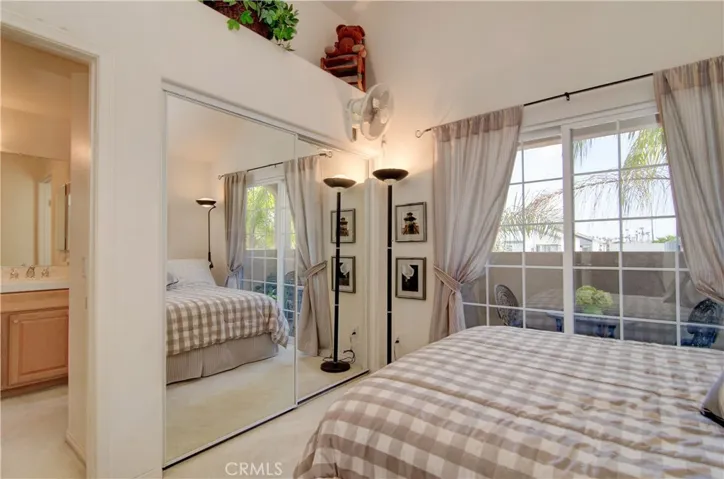 Roomy secondary bedroom has large wardrobe closet, balcony and shares Jack and Jill bath.