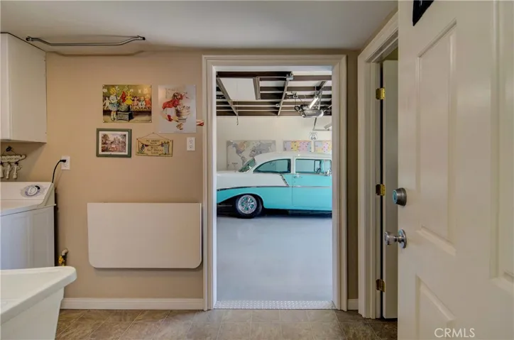 Garage building has loads of storage, plus big laundry/utility room and an additonal room that works well for home office or gaming.