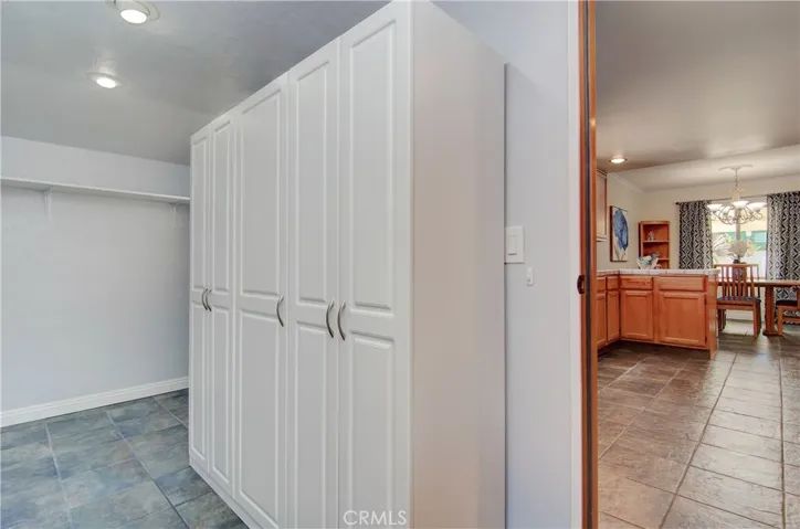 Huge panty/storage room has outside entrance and is the ultimate "Costco room."