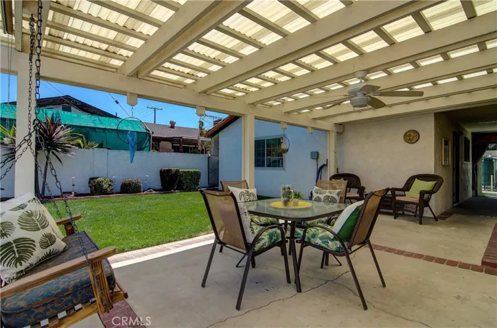 What a great place to hang out with family and friends.  Note covered breezeway that connects garage building to main home.