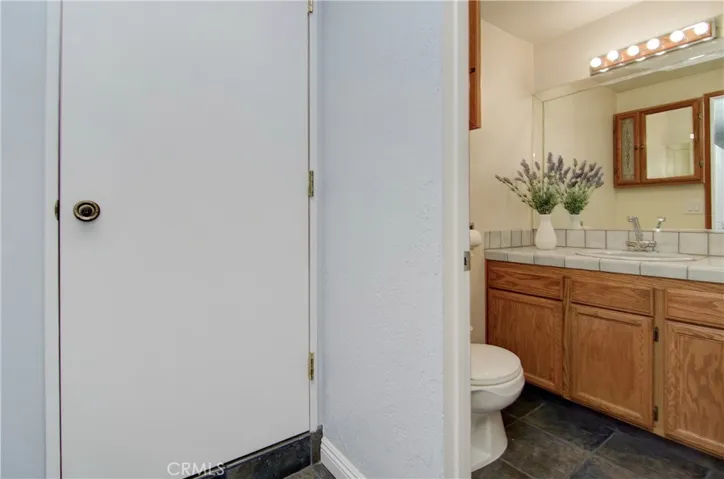 Bath and pantry/utility room connect to bonus room offering excellent ADU/in-law possibilities.