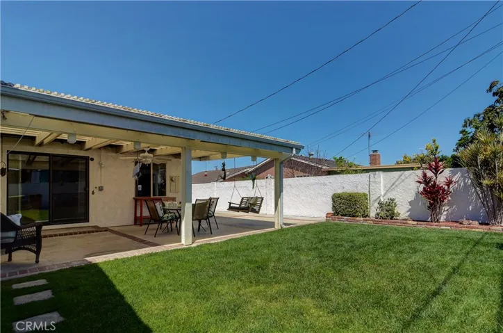 Just enough of everything...grassy yard, landscape planter areas, and entertainer's covered patio.