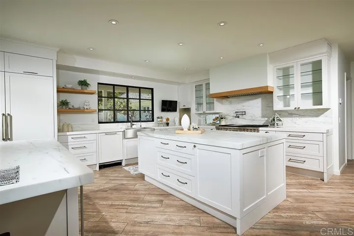 The Perfect Kitchen, looks over the pool, just off the Family Room: Great Space showered in Light!