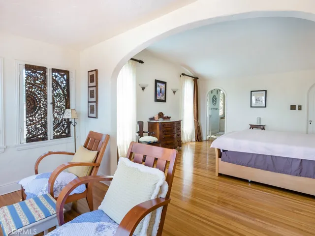 Master bedroom with sitting area and lovely views.