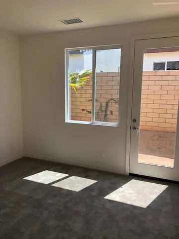 bed 2 with glass door to small backyard