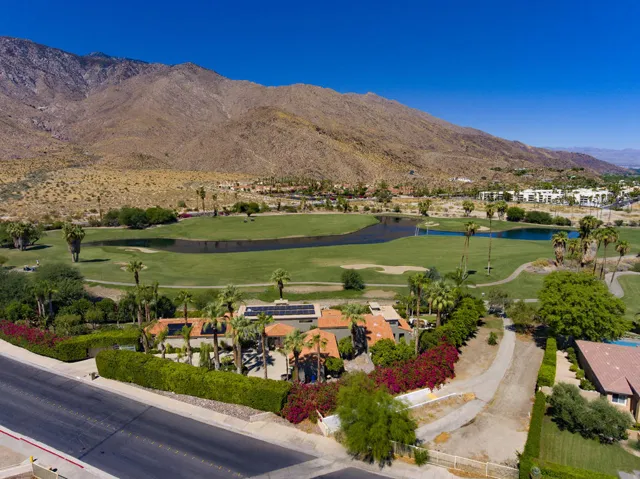 DRONE FRONT TO FAIRWAY AND MOUNTAINS MLS