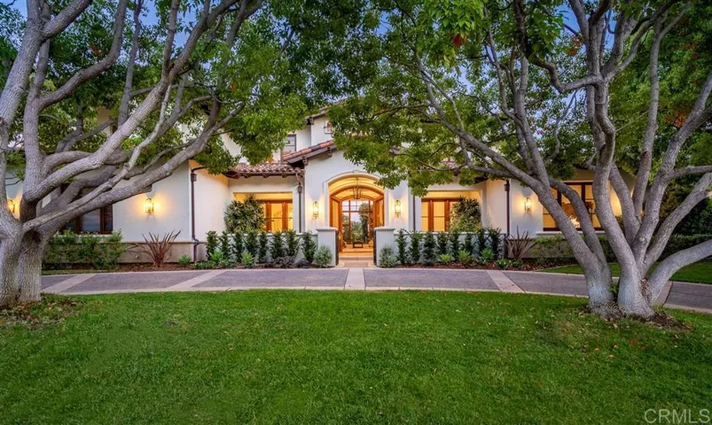 Beautiful mature trees and half circle driveway frame the entrance to this custom estate.  The expansive home has a flexible flowing layout for indoor outdoor living. Extensively remodeled in 2019-2020 it now has a fresh look for modern & timeless appeal.