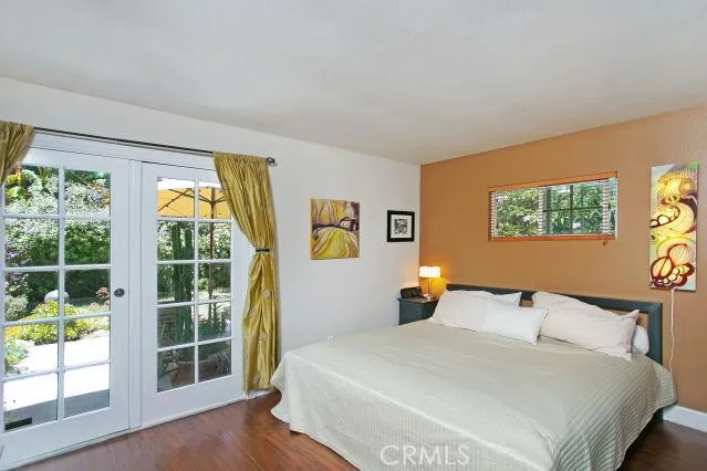 Master bedroom with French doors to backyard seating area