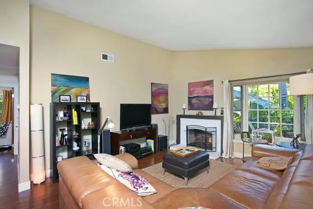 Family room with wood/gas fireplace and bay window