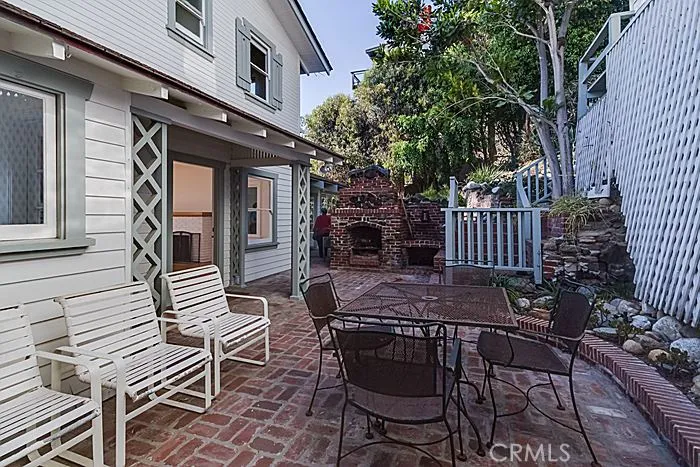 This is the front patio, that includes a fireplace.  Because it is sheltered from any wind, it is a perfect place to enjoy outdoor dining on a cool evening!