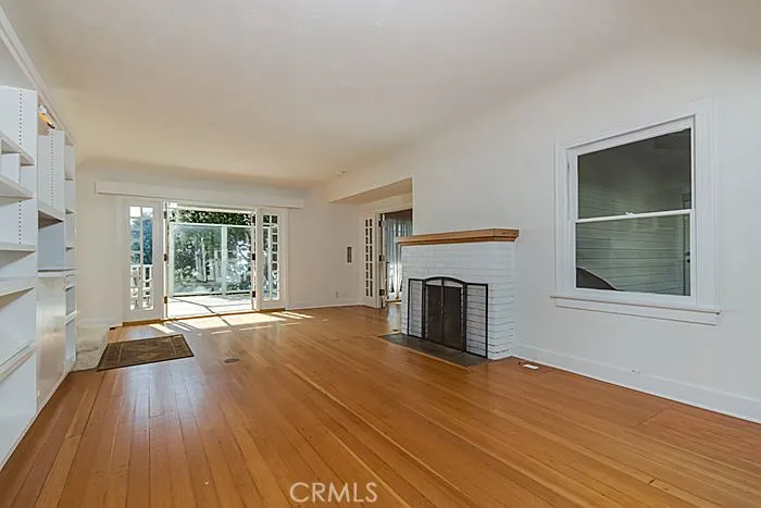 This is the living room.  The French doors in front lead to the large, ocean view deck.  The French doors on the side lead to the very large family room.